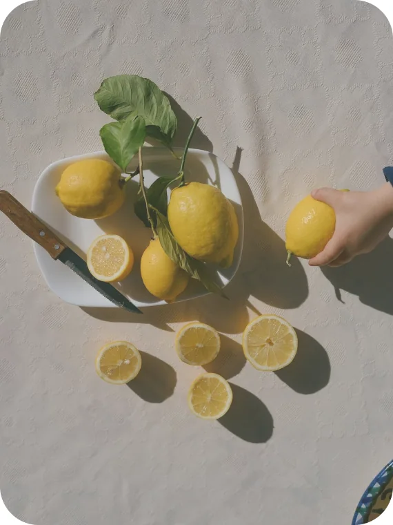 Lemons and lemon slices on a table