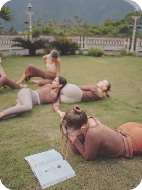 Women resting together on a lawn